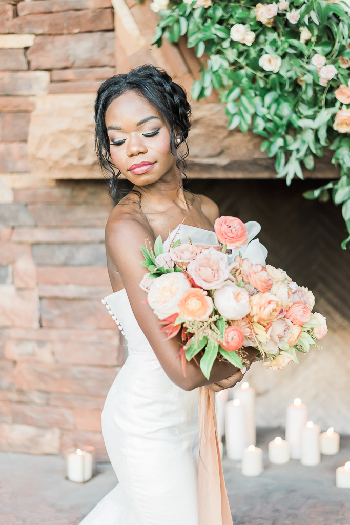 Portrait of a beautiful bride and her wedding bouquet. 